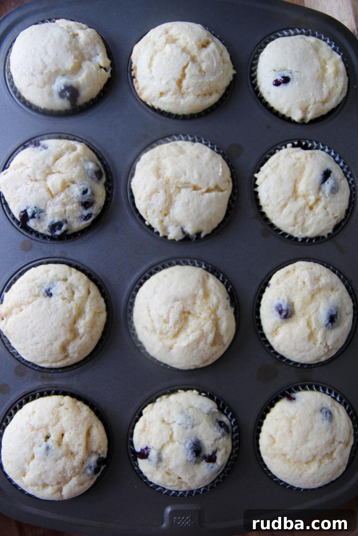 twelve baked cupcakes in a muffin tin 