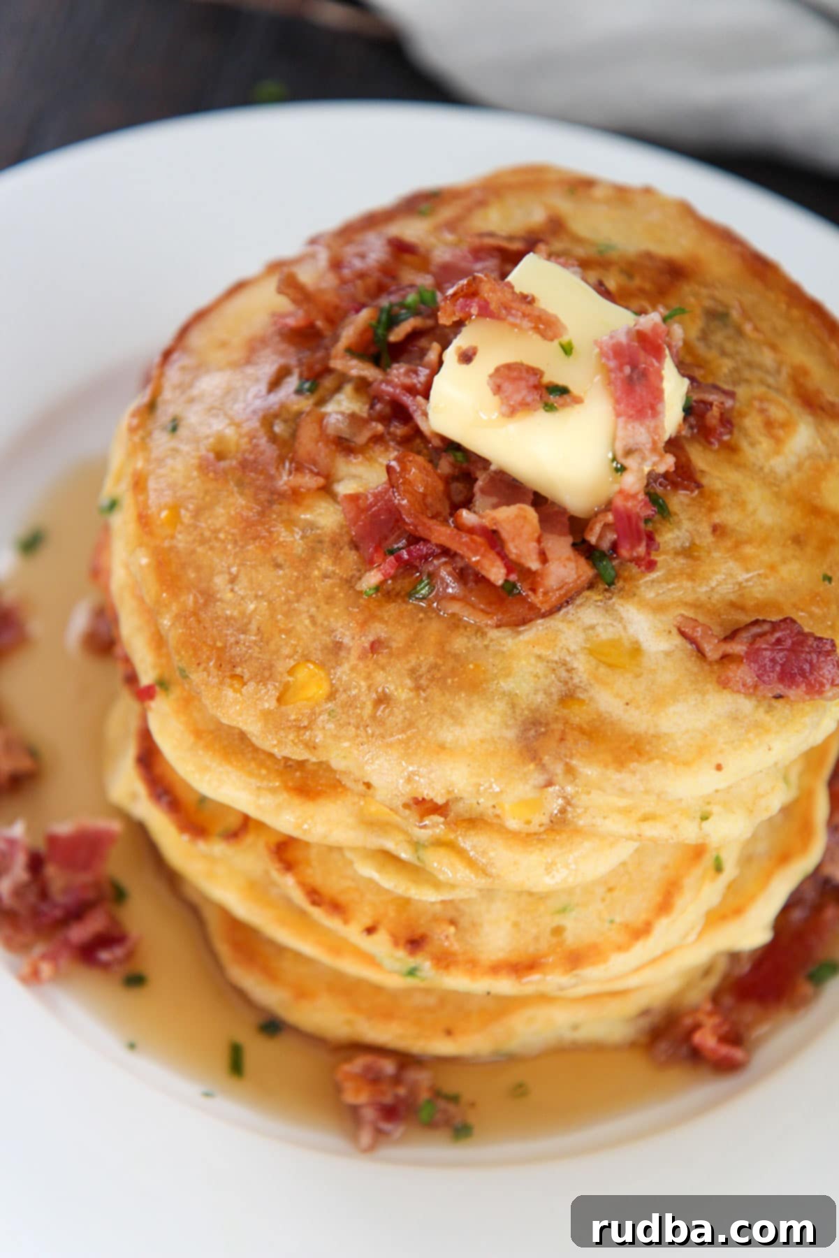 five corn cakes on a plate. 