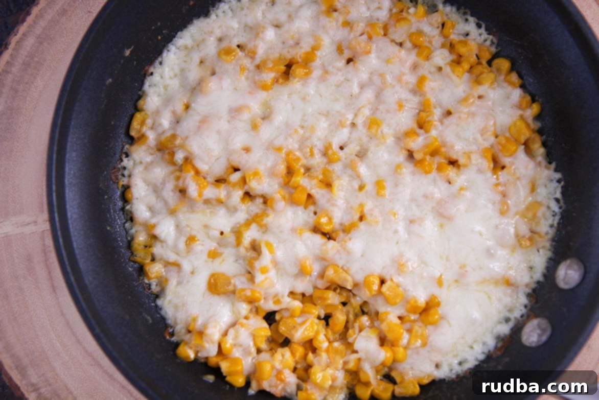 cheesy corn in a skillet. 