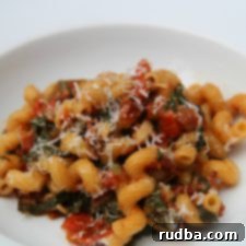 Savory Pancetta Spinach Pasta 6 Pancetta and Spinach Pasta, a flavorful dish with roasted tomatoes and garlic.