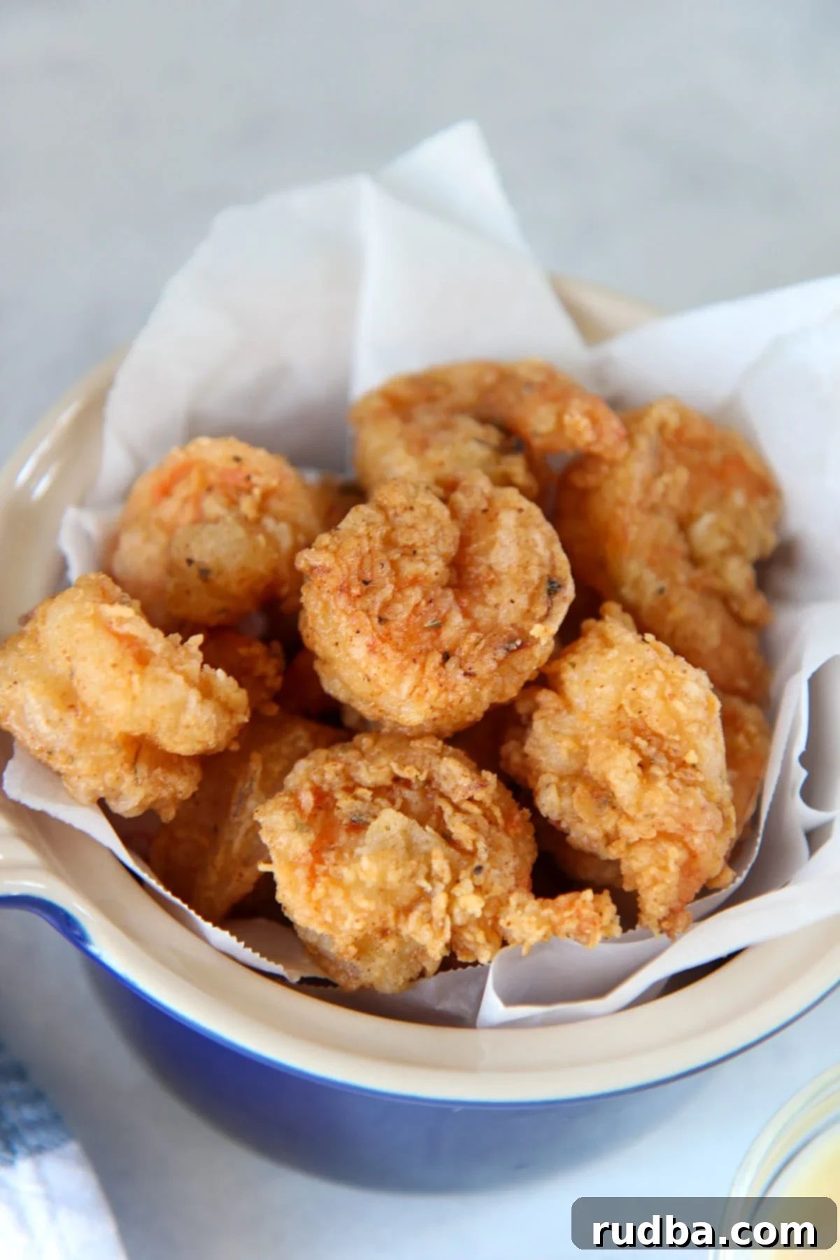fried shrimp in a blue small bowl 