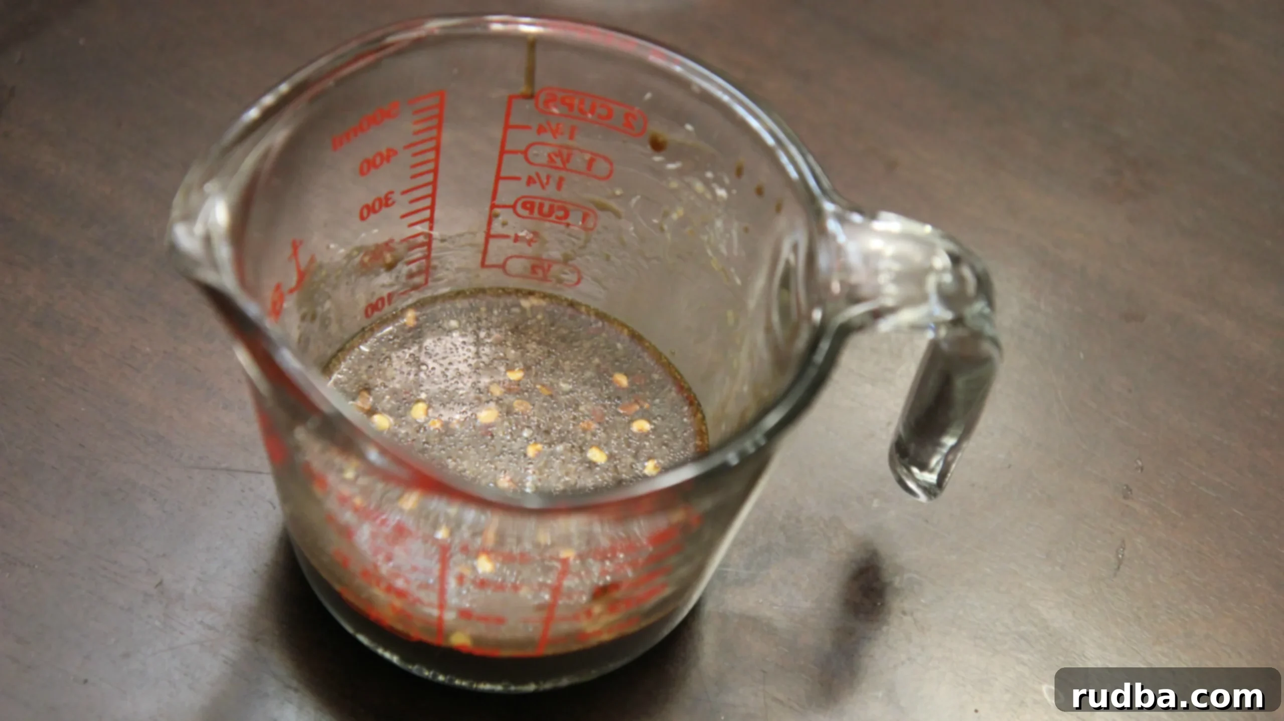 Soy Sauce in a measuring cup. 