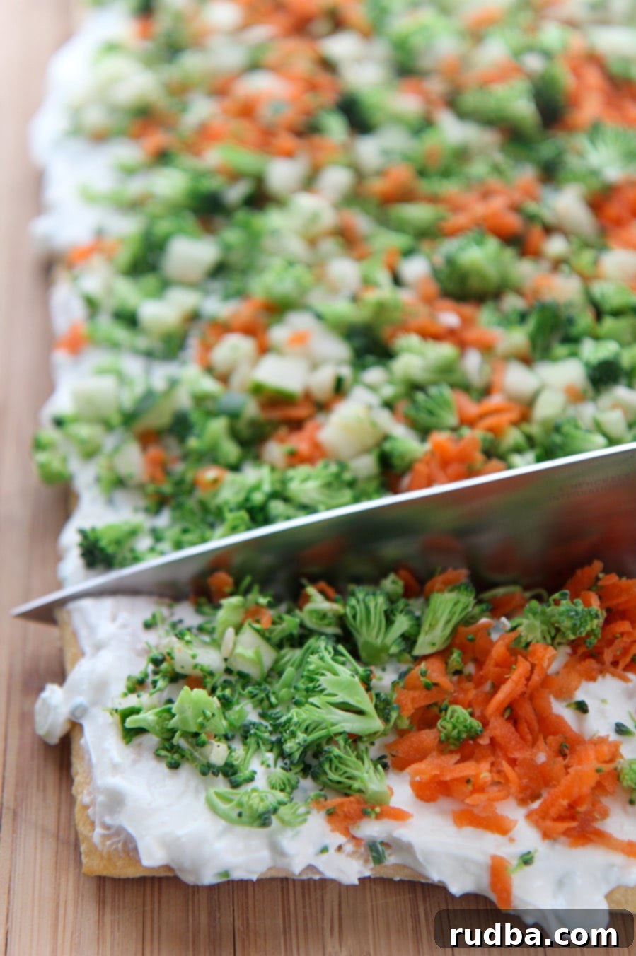 a knife cutting into the veggie bars