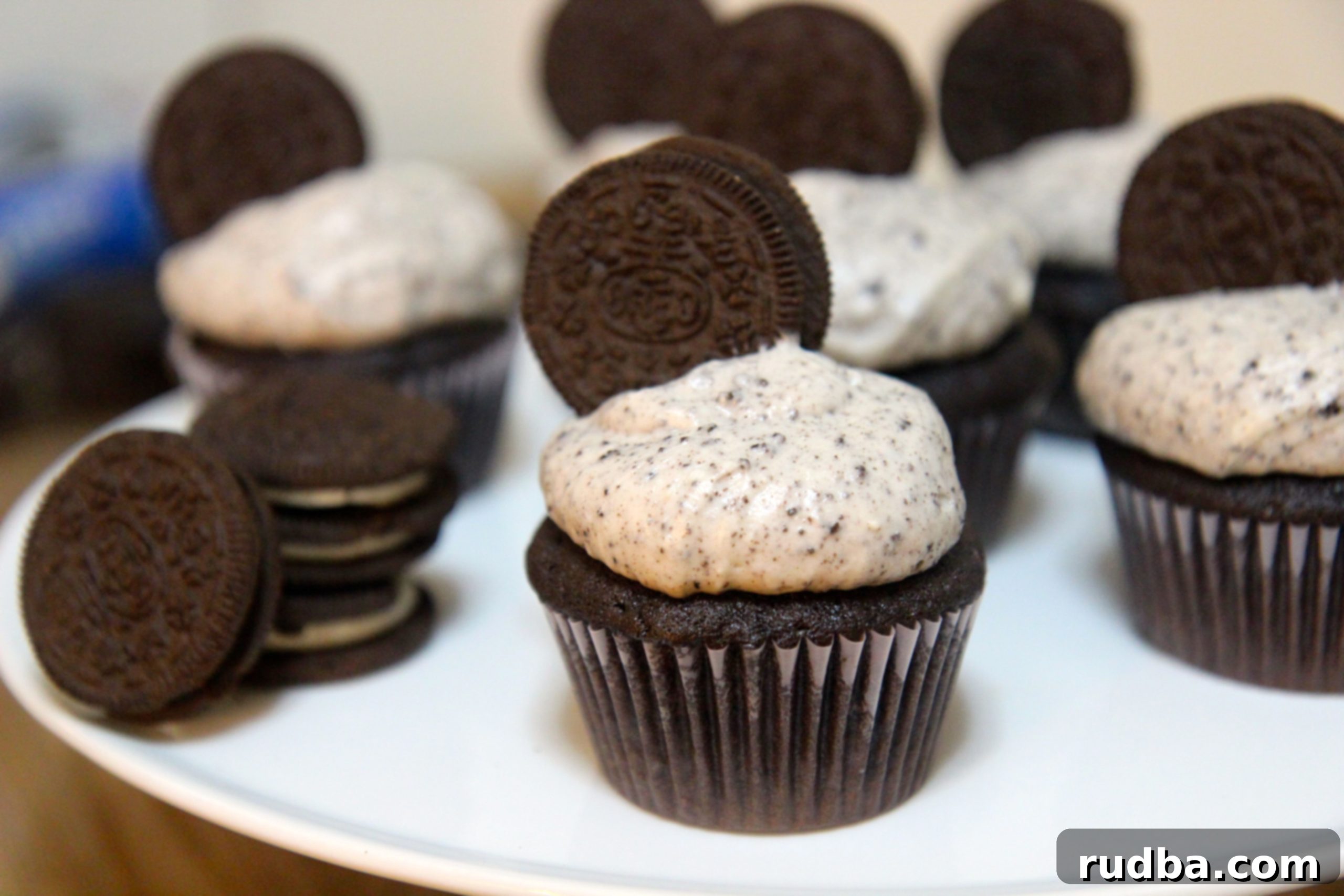 Delicious Oreo Cupcakes with Cream Cheese Oreo Frosting, topped with an Oreo cookie