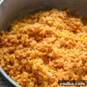 Golden Yellow Rice with Sweet Corn 4 yellow rice with corn in a big pot.