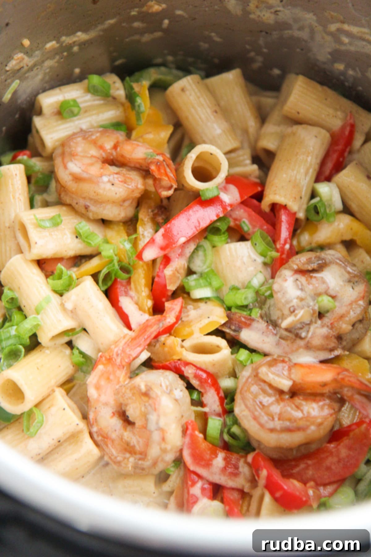 Creamy Instant Pot Rasta Pasta with Shrimp, colorful bell peppers, and fresh scallions.