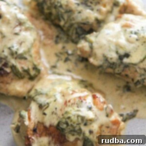 Effortless Instant Pot Tuscan Chicken 4 4 bone-in chicken thighs with spinach and cream on top.