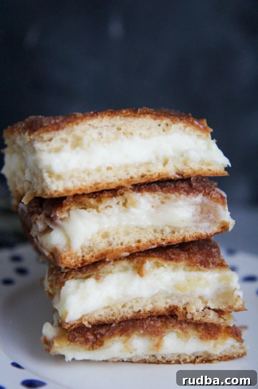 four cheesecake bars stacked on top of each other 