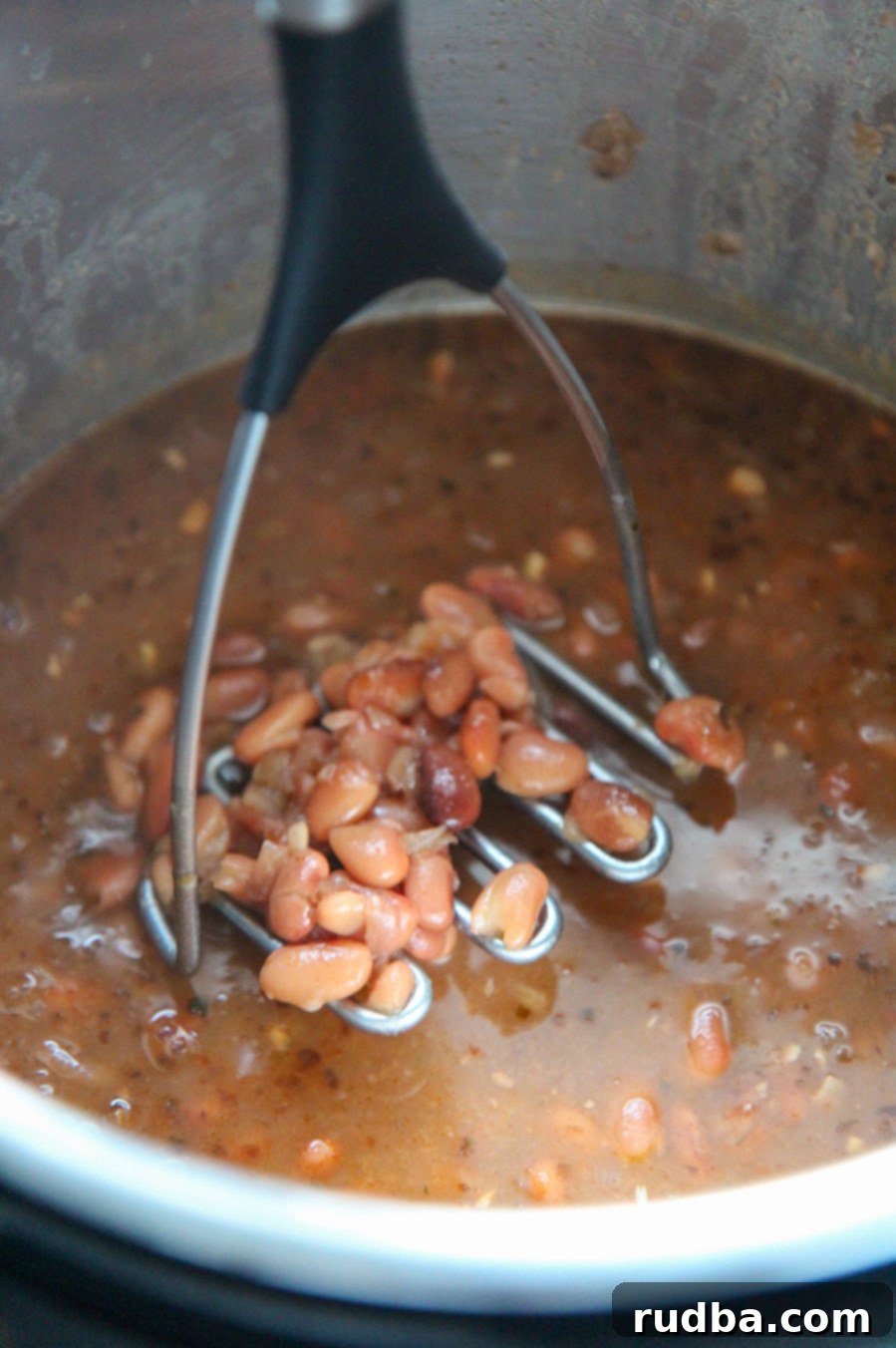 cooked pinto beans in the instant pot with a potato masher.