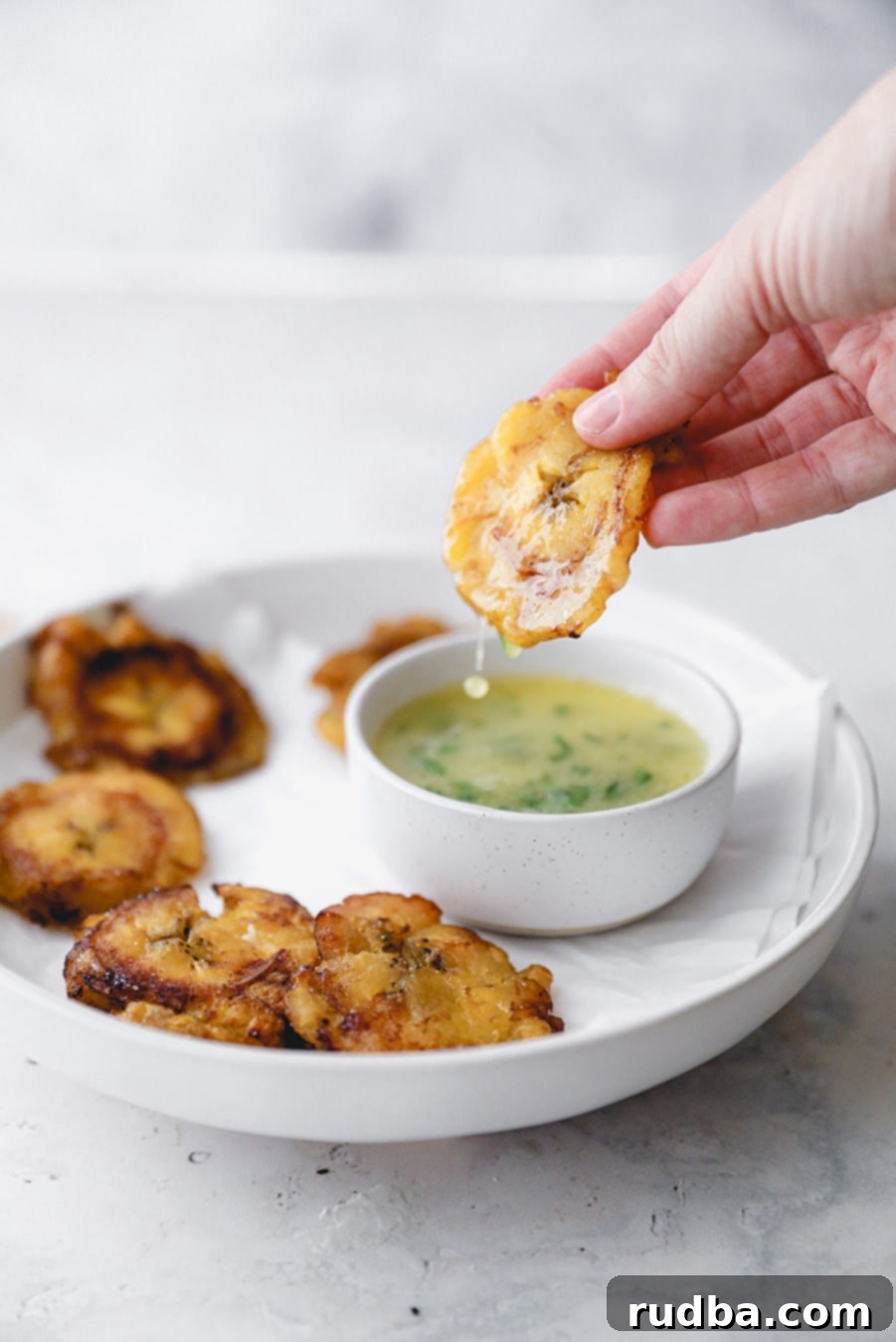 a fried plantain dipped in garlic butter sauce. 
