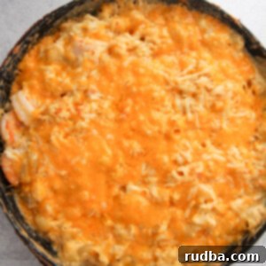 Ocean's Bounty Mac and Cheese 4 seafood macaroni and cheese in a black cast iron skillet.