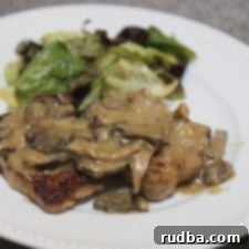 Luscious Garlic Cream Pork Chops 5 Creamy Garlic Pork Chops in a skillet.