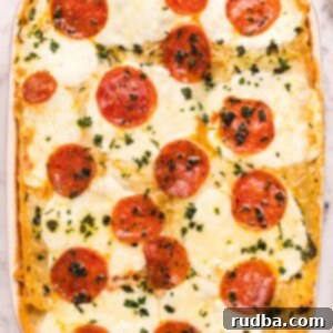 pizza lasagna in a red casserole