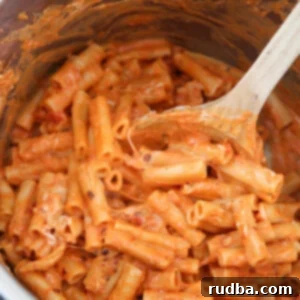 Easy Instant Pot Baked Ziti 4 baked ziti in the instant pot with a wooden spoon