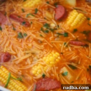 Hearty Salami Soup 4 Sopa de Salchichon, a hearty Puerto Rican salami soup, served in a large pot.