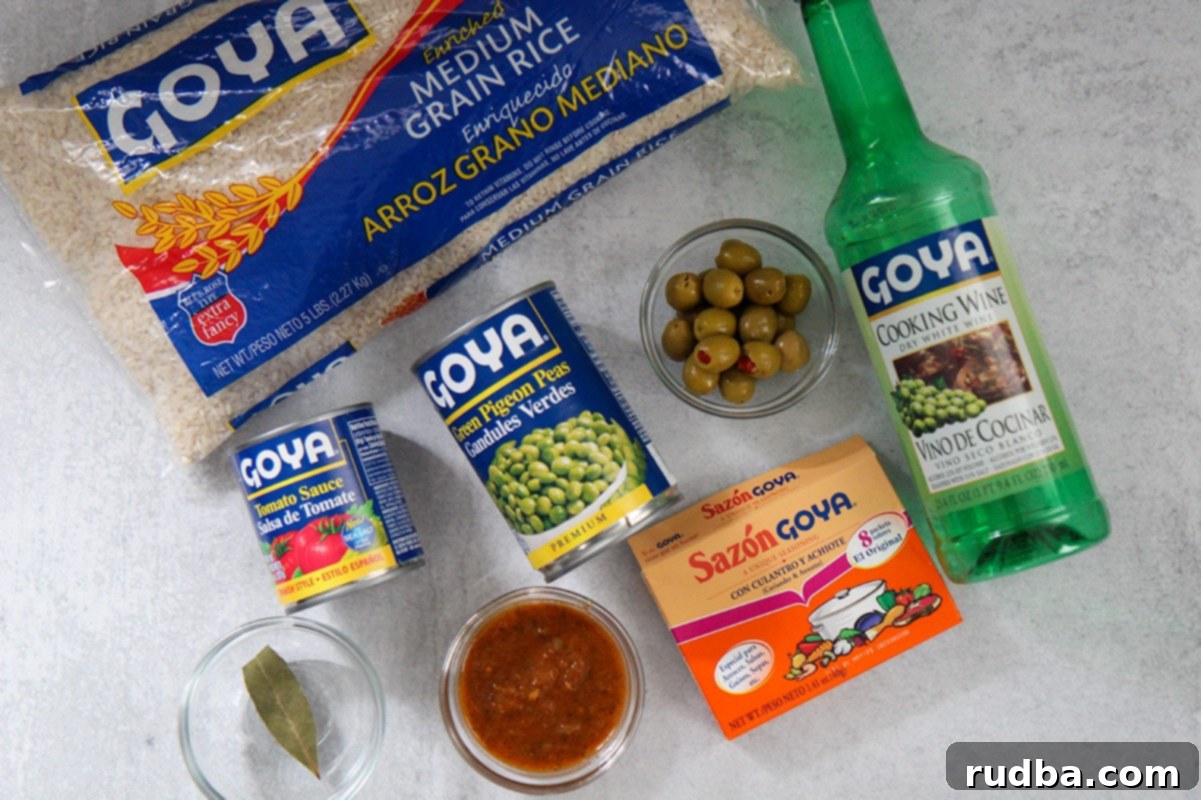 Arroz con Gandules - Rice and Pigeon Peas 3 8 packaged ingredients including rice, olives, sazon, tomato sauce, sofrito, cooking wine, and a bay leaf.