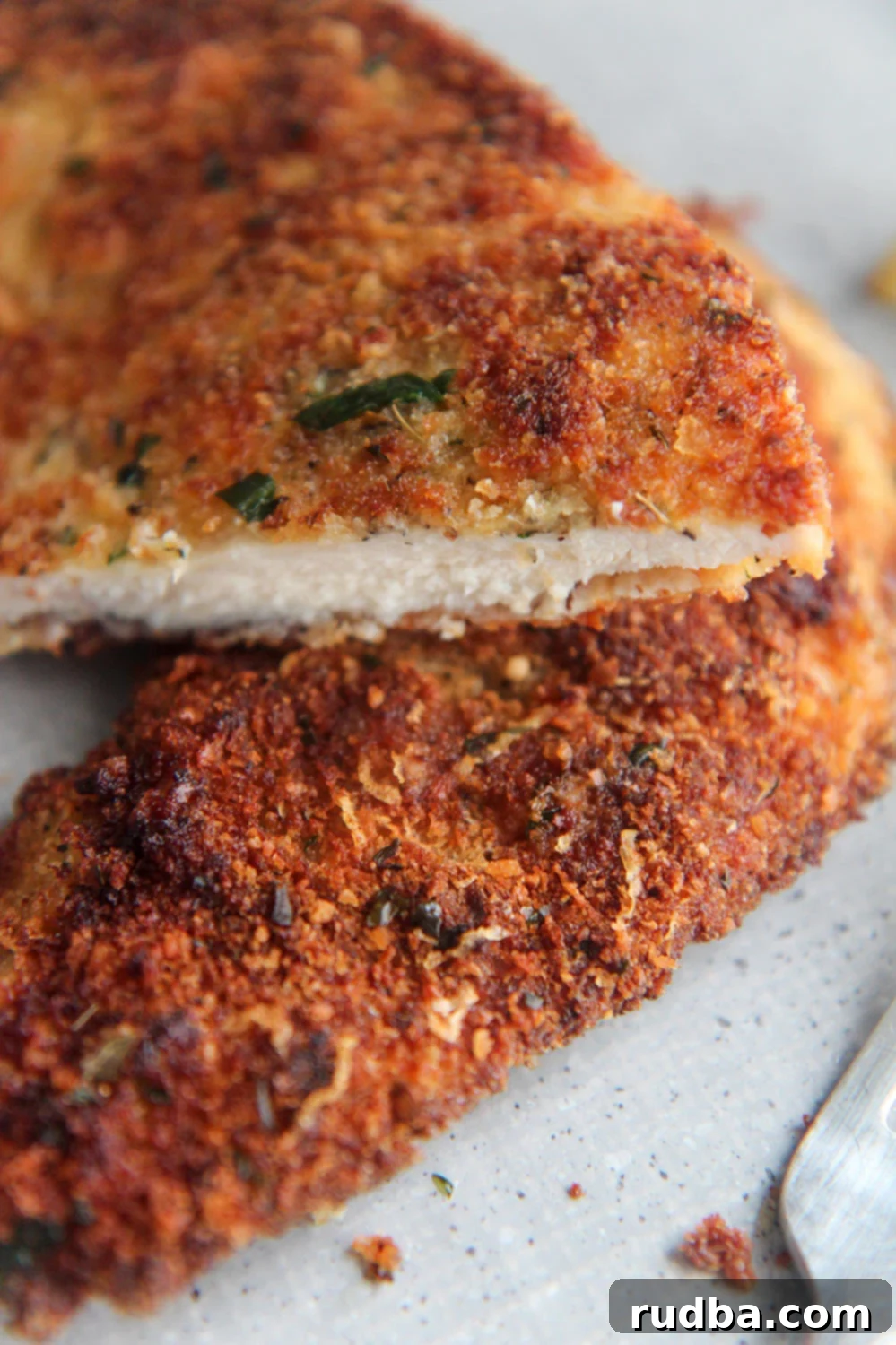 fried chicken cutlets cut in half. 