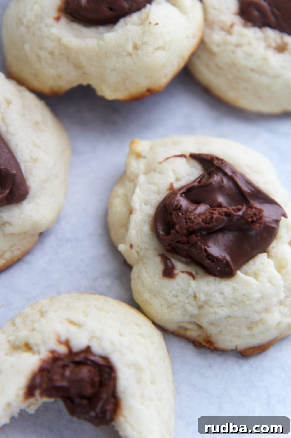 Close-up of a cream cheese Nutella cookie, showing its soft texture and the rich Nutella filling.