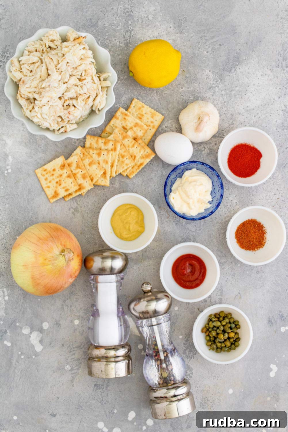 Golden Crab Cakes with Zesty Remoulade 3 crab, mayo, lemon, salt, pepper, onion, saltine crackers, and spices.