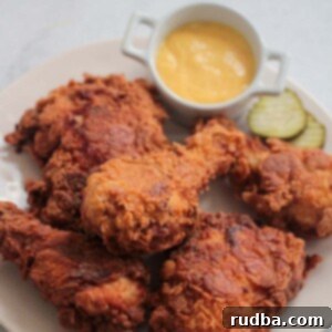 Homestyle Buttermilk Fried Chicken 2 buttermilk fried chicken on a plate.