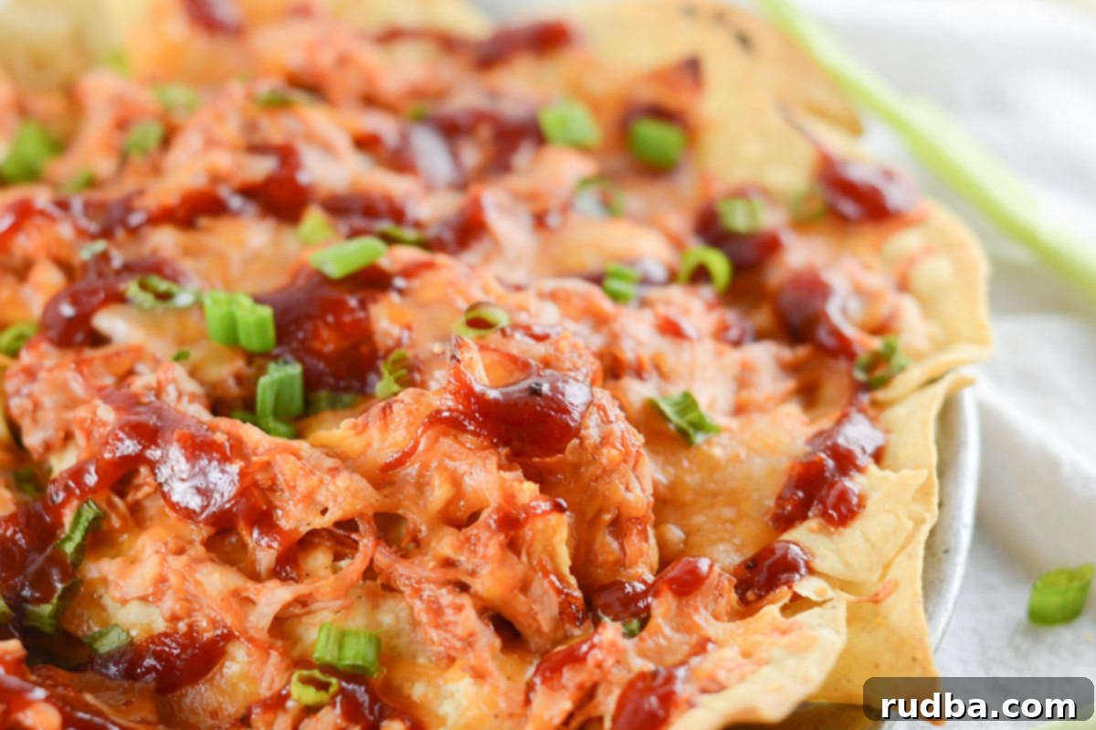 cheesy chicken nachos on a plate 