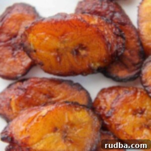 Deliciously fried plantain slices, golden brown and perfectly caramelized.