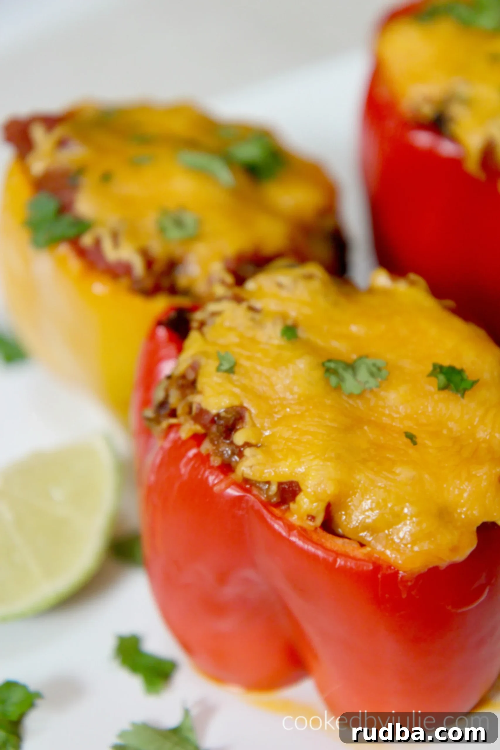 These taco stuffed peppers are a super easy, cheesy, and delicious weeknight dinner