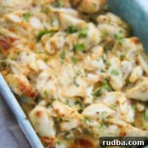 Baked crab imperial in a blue baking dish.
