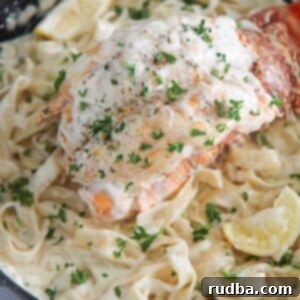 Decadent Lobster Alfredo Fettuccine 2 lobster fettuccine alfredo in a skillet.