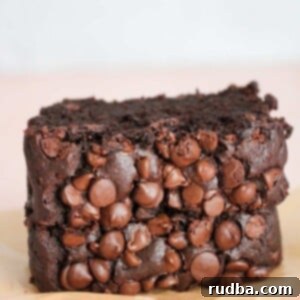 Decadent Chocolate Banana Bread 2 Two slices of indulgent chocolate banana bread, ready to be enjoyed.