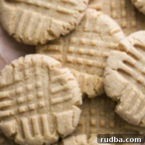 Melt in Your Mouth Peanut Butter Cookies 2 baked soft peanut butter cookies up close.