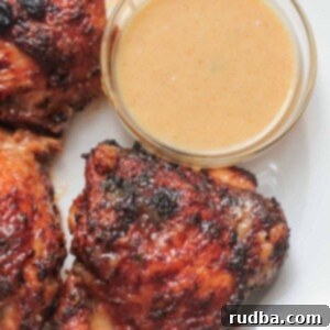 air fryer chicken thighs with a side of honey mustard.