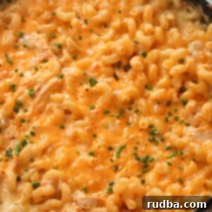 Buffalo Chicken Mac Attack 2 Buffalo chicken mac and cheese with green chives on top.