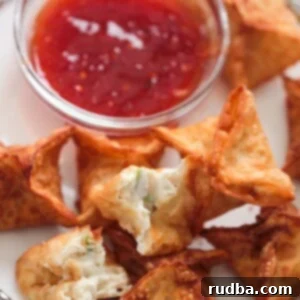 Crispy Crab Rangoons 2 crab rangoons with sweet chili sauce on the side.