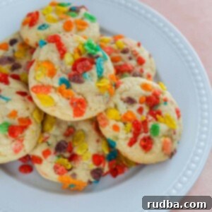 Fruity Pebbles cookies on a white plate.