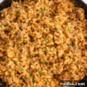 Homestyle Beef Pasta Skillet 2 Homemade hamburger helper in a black skillet with chives on top.