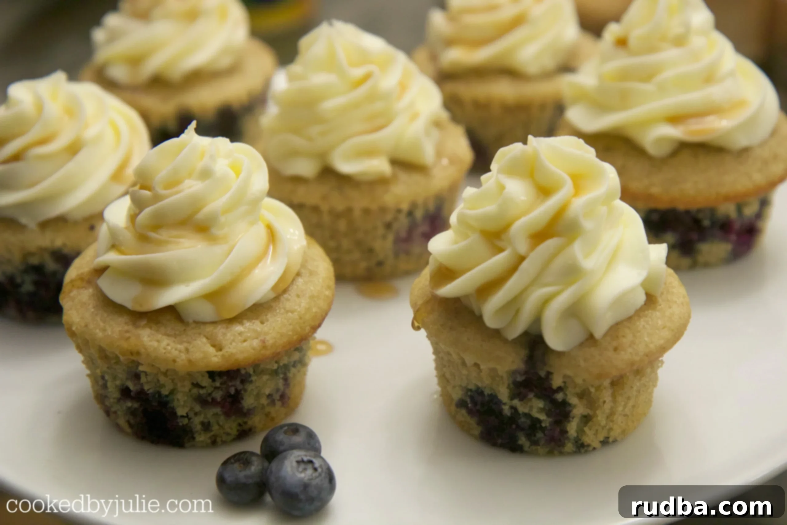 Delicious Blueberry Pancake Cupcakes on a baking sheet, ready to be frosted.