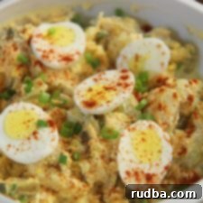 Classic Potato and Egg Salad 3 potato and egg salad in a white bowl.