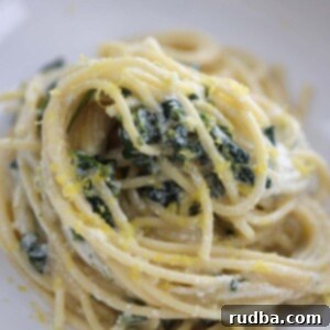 lemon ricotta pasta in a white dish up close.