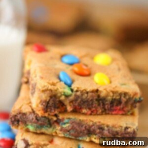 Three M&M's chocolate chip cookie bars up close.