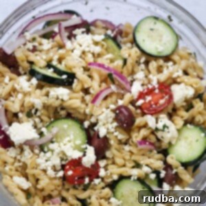 Refreshing Greek Pasta Salad 2 Greek pasta salad in a large glass bowl.