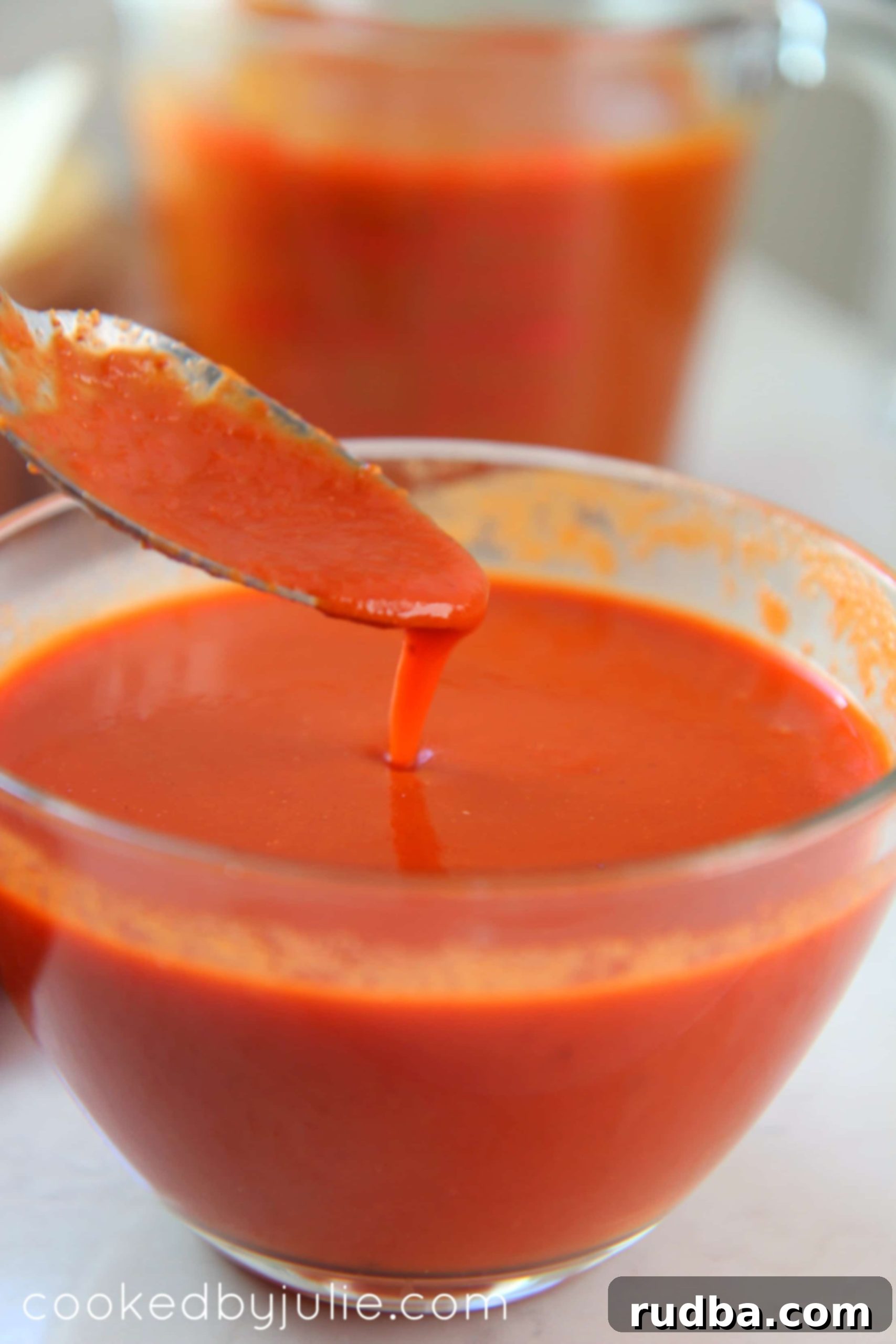 Homemade red enchilada sauce in a small bowl, rich in color and texture