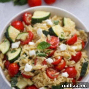lemon orzo pasta salad in a white bowl.