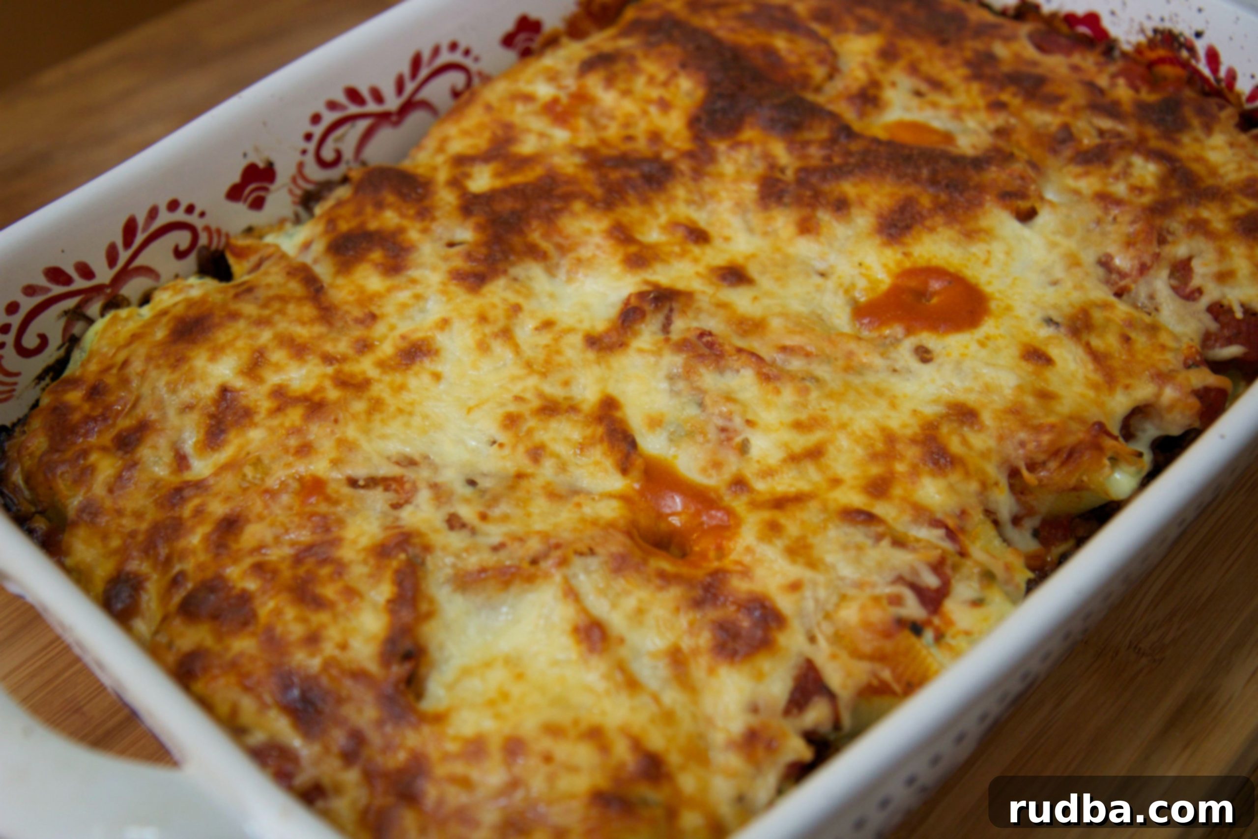 Delicious vodka stuffed shells with ricotta, spinach, and mozzarella cheese in a baking dish, ready to be served.