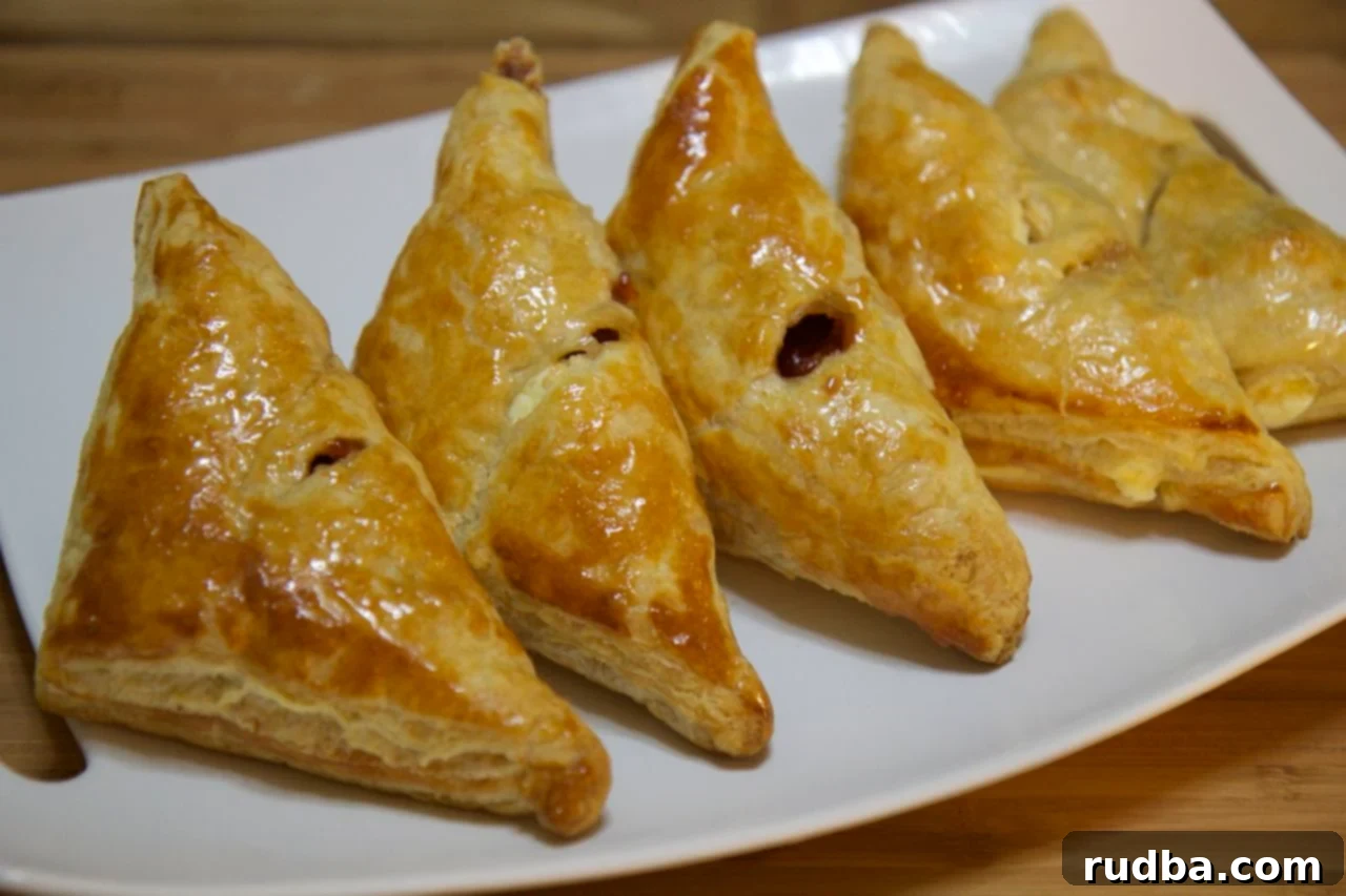 Delicious Guava and Cheese Pastries (Pastelitos de Guayaba y Queso) perfect for breakfast or dessert, showcasing flaky pastry and vibrant filling.