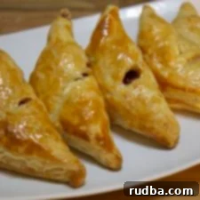 Guava Cheese Dream Puffs 4 pastelitos de guayaba y queso on a white plate.