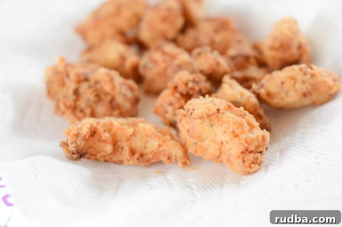 small pieces of fried chicken on paper towel 