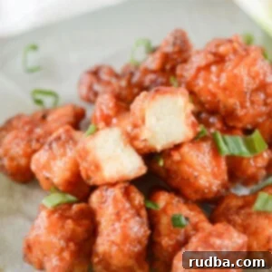 honey boneless bbq wings with scallions on a green plate