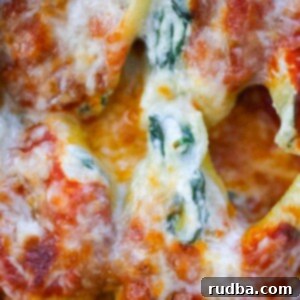 Creamy Spinach and Ricotta Stuffed Shells 2 spinach and ricotta stuffed shells up close.
