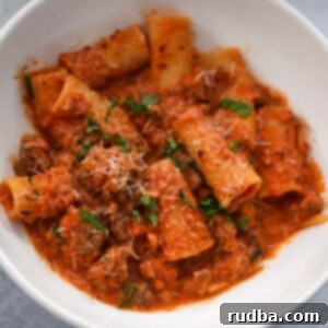 rigatoni with basil and parmesan cheese on top.